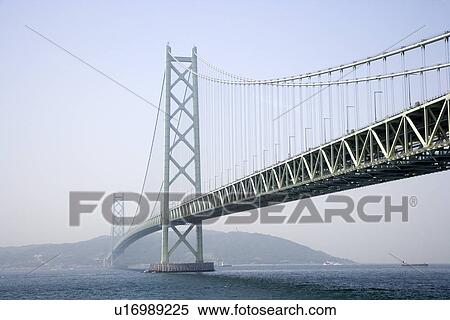 Stock Photography - Japan, Kobe, Akashi-Kaikyo Bridge across Akashi Strait. Fotosearch