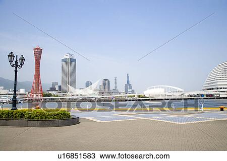 Stock Image - Japan, Kobe harbour and cityscape. Fotosearch