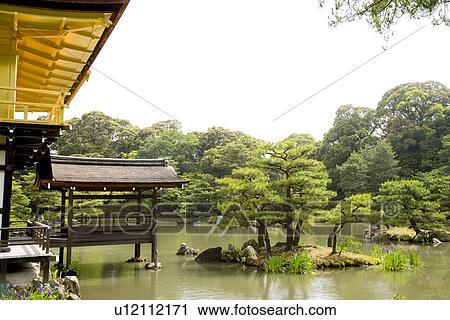 Stock Image - Japan, Kyoto, Kinkakuji Temple in garden on lake . Fotosearch