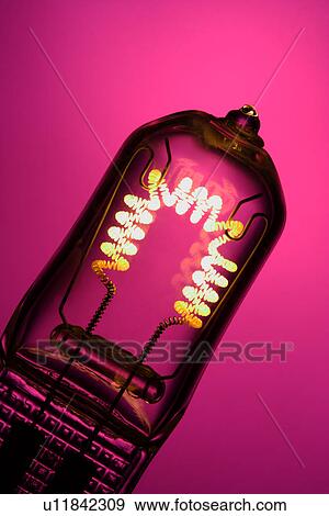 Stock Photo - A lit light bulb against pink background. Fotosearch