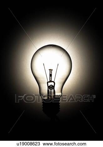 A lit light bulb View Large Photo Image Stock Image - A lit light bulb. Fotosearch