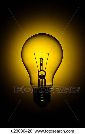 A lit light bulb View Large Photo Image Stock Image - A lit light bulb. Fotosearch
