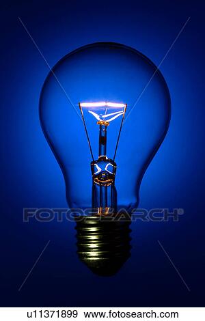 A lit light bulb View Large Photo Image Stock Photo - A lit light bulb. Fotosearch