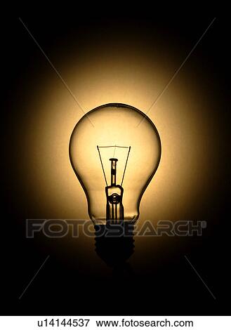 A lit light bulb View Large Photo Image Stock Photo - A lit light bulb. Fotosearch