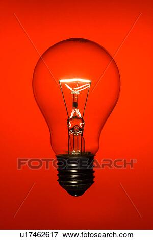 Stock Photo - A lit light bulb. Fotosearch
