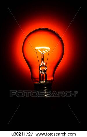A lit light bulb View Large Photo Image Stock Photo - A lit light bulb. Fotosearch