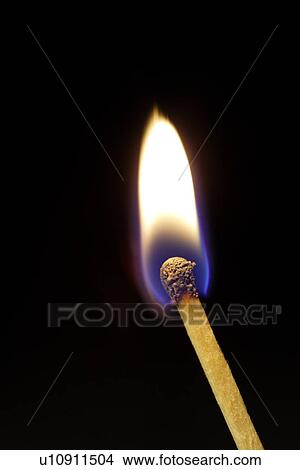 Picture - Lit candle, close-up. Fotosearch