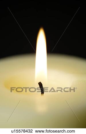 Stock Image - Lit candle, close-up. Fotosearch