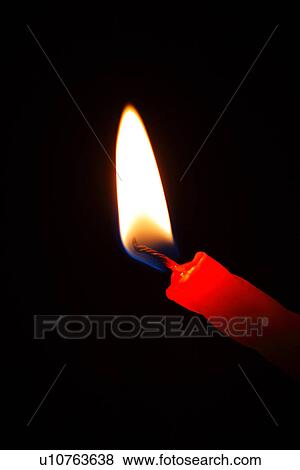 Stock Photo - Lit candle, close-up. Fotosearch
