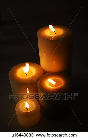 Stock Image - Lit candles. Fotosearch