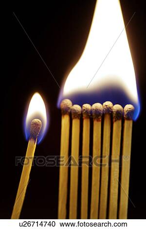 Stock Image - Matches on fire, close-up. Fotosearch