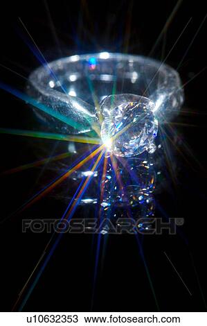 Stock Image - Diamond emitting light spectrum, close-up . Fotosearch