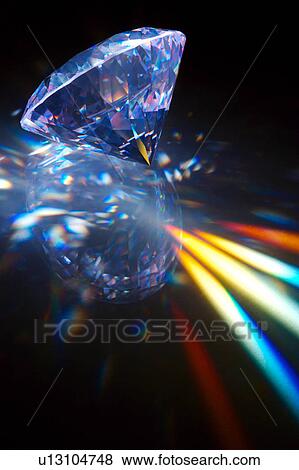 Stock Photo - Diamond emitting light spectrum, close-up . Fotosearch