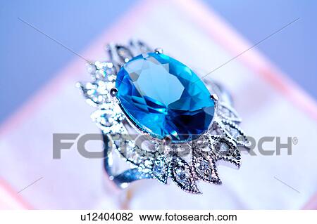 Stock Image - Diamond ring in box, close-up . Fotosearch