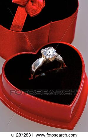 Diamond ring in heart shaped box, close-up View Large Photo Image Stock Image - Diamond ring in heart shaped box, close-up . Fotosearch