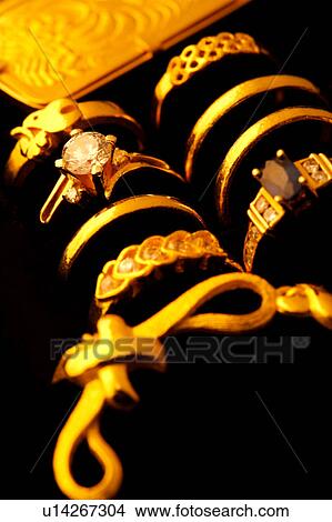Golden rings and pendant in box, close-up View Large Photo Image Picture - Golden rings and pendant in box, close-up. Fotosearch