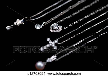Picture - Necklaces with diamond and pearl. Fotosearch