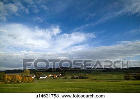 Stock Photo - Rural scene under blue sky. Fotosearch