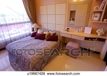 Stock Photo - Bedroom in modern home. Fotosearch