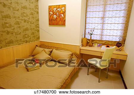 Stock Image - Bedroom with desk and chair. Fotosearch