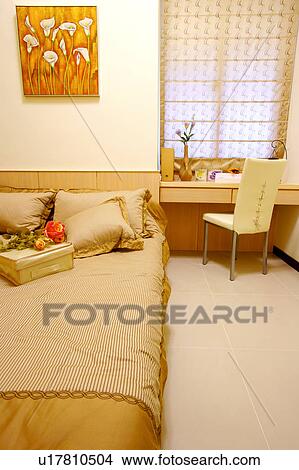 Picture - Bedroom with table and chair. Fotosearch