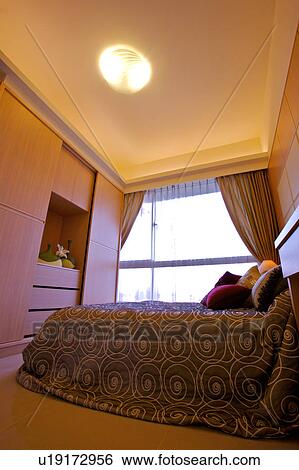 Low angle view of a bed View Large Photo Image Stock Photograph - Low angle view of a bed. Fotosearch