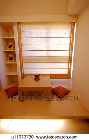 Stock Image - Sitting room with cushions. Fotosearch