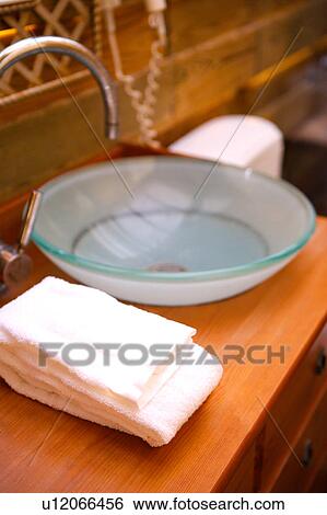 A bowl and towel on dressing table View Large Photo Image Stock Photograph - A bowl and towel on dressing table. Fotosearch