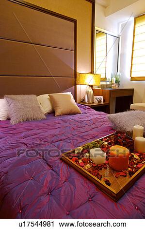 A Tray Of Flowers And Candles On Bed Stock Image