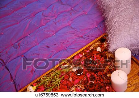 A tray of flowers and candles on the bed, high angle view View Large Photo Image Stock Image - A tray of flowers and candles on the bed, high angle view. Fotosearch