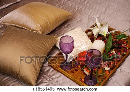 A tray of petals and goblets on the bed, close-up View Large Photo Image Stock Photography - A tray of petals and goblets on the bed, close-up. Fotosearch