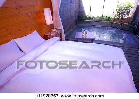 Bedroom with bathing pool by its side View Large Photo Image Stock Photo - Bedroom with bathing pool by its side. Fotosearch