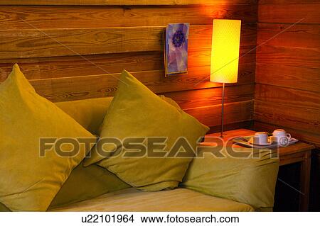Picture - Couch with two pillows on it. Fotosearch