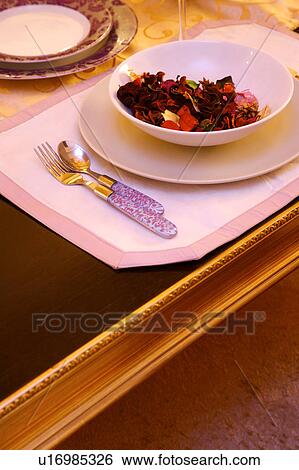 Stock Photograph - Place setting on dining table. Fotosearch