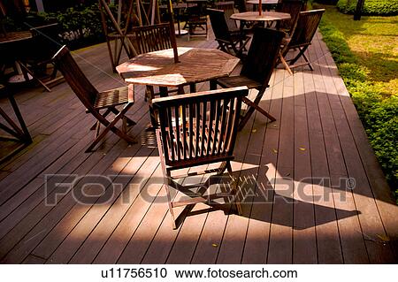 Wooden chairs and garden tables View Large Photo Image Stock Image - Wooden chairs and garden tables. Fotosearch