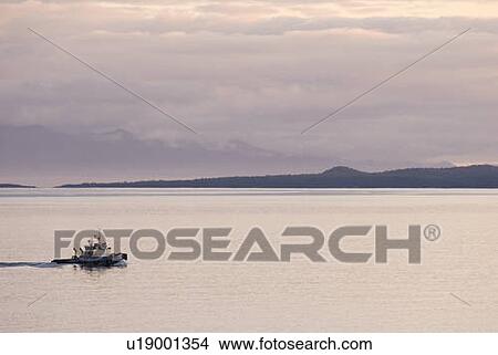A Tugboat passes the Dallas Road Waterfront in Victoria, BC View Large Photo Image Picture - A Tugboat passes the Dallas Road Waterfront in Victoria, BC. Fotosearch