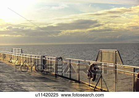 Sunset reflection off the railing on a BC Ferry View Large Photo Image Stock Photography - Sunset reflection off the railing on a BC Ferry. Fotosearch