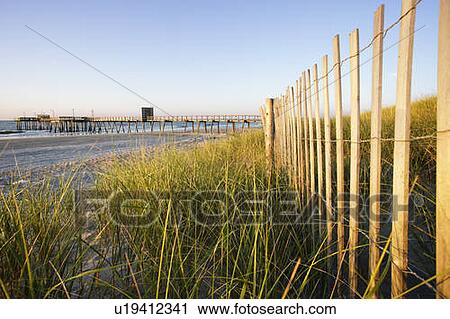 Stock Image - View of beach at sunrise, New Jersy, USA. Fotosearch