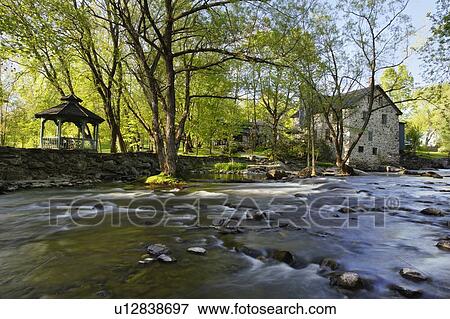 View of old Freligh mill and Brochets river, Eastern Townships, Quebec, Canada. View Large Photo Image Stock Photo - View of old Freligh mill and Brochets river, Eastern Townships, Quebec, Canada.. Fotosearch