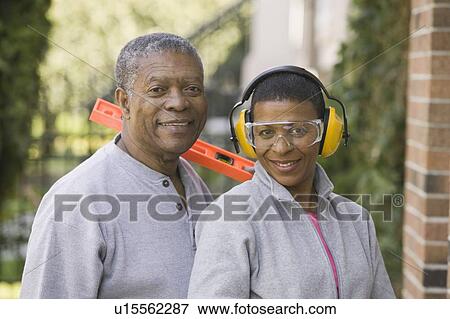 Stock Photo - African American couple doing home improvement, Vancouver, BC. Fotosearch
