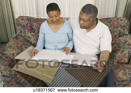 African American couple going over tile and carpet samples, Vancouver, BC View Large Photo Image Stock Photo - African American couple going over tile and carpet samples, Vancouver, BC. Fotosearch