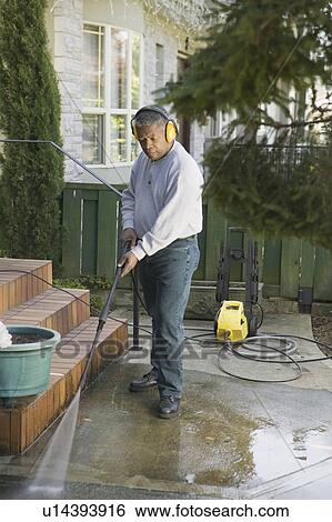 African American man using a power washer, Vancouver, BC View Large Photo Image Stock Photograph - African American man using a power washer, Vancouver, BC. Fotosearch