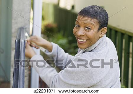 African American woman doing home improvement, B. C. View Large Photo Image Stock Image - African American woman doing home improvement, B. C.. Fotosearch