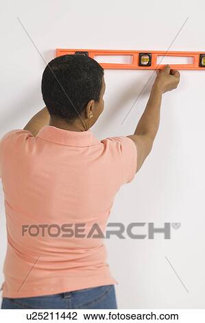 African American Woman Doing Home Improvement, Using a Spirit Level, Canada, British Columbia View Large Photo Image Stock Image - African American Woman Doing Home Improvement, Using a Spirit Level, Canada, British Columbia. Fotosearch