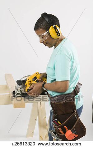 African American Woman Doing Home Improvement, Cutting Lumber With a Skill Saw, B. C. View Large Photo Image Stock Image - African American Woman Doing Home Improvement, Cutting Lumber With a Skill Saw, B. C.. Fotosearch