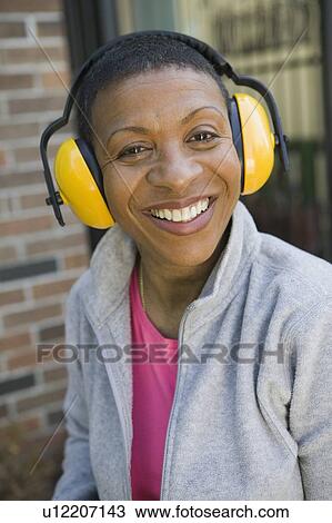 African American woman wearing hearing protection, Vancouver, BC View Large Photo Image Stock Image - African American woman wearing hearing protection, Vancouver, BC. Fotosearch