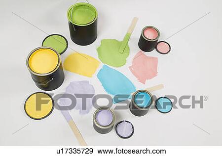 Stock Photo - Open paint cans, lids, colour swatch and stir sticks, Canada, British Columbia. Fotosearch
