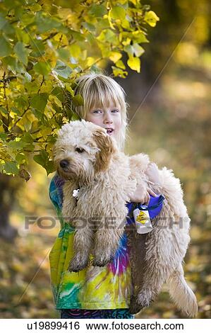 Stock Photograph - 5 year old girl and her dog, Sidney BC Canada. Fotosearch