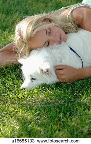 Blonde female with dog on grass, Regina, Saskatchewan View Large Photo Image Stock Image - Blonde female with dog on grass, Regina, Saskatchewan. Fotosearch