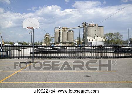 Basketball court near a factory View Large Photo Image Picture - Basketball court near a factory. Fotosearch